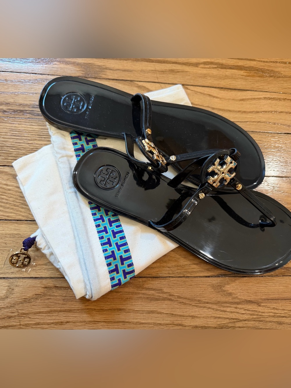 Tory Burch Black Jelly Logo Thong Sandals with Gold Medallion